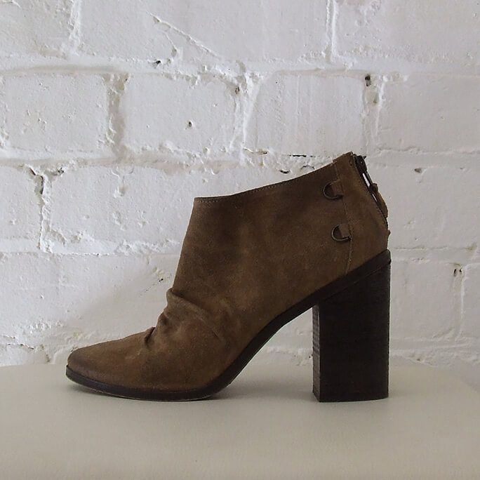 Light brown suede ankle boots, intentional aging.