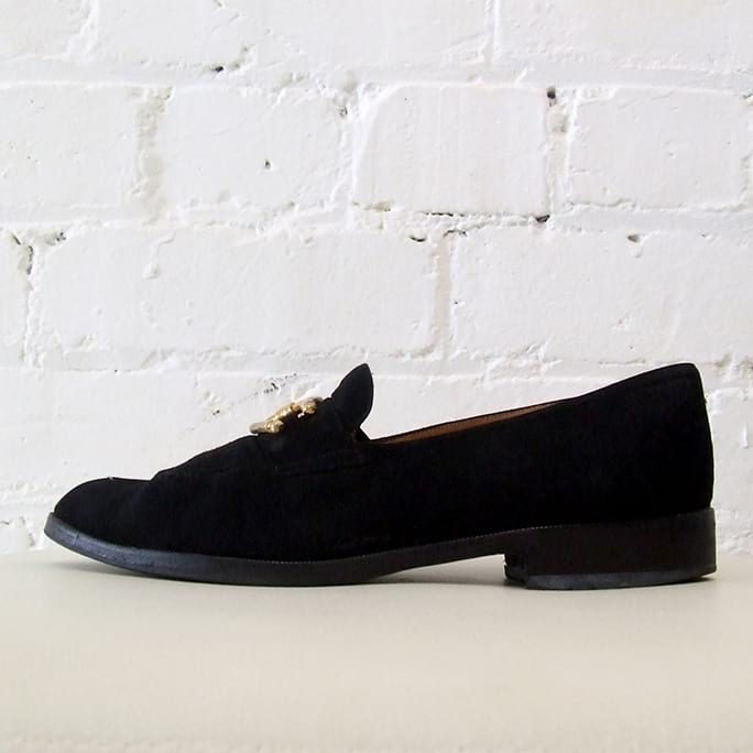 Suede loafer with horse shoe buckle.