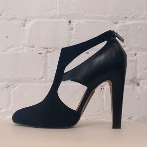 High heel shoe with cut-outs.