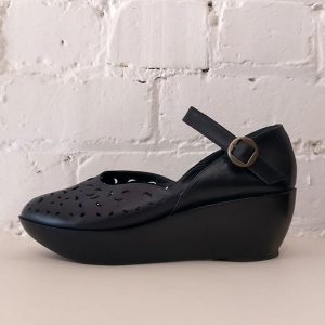 Wedge sandals with ankle strap and cut-out detail.