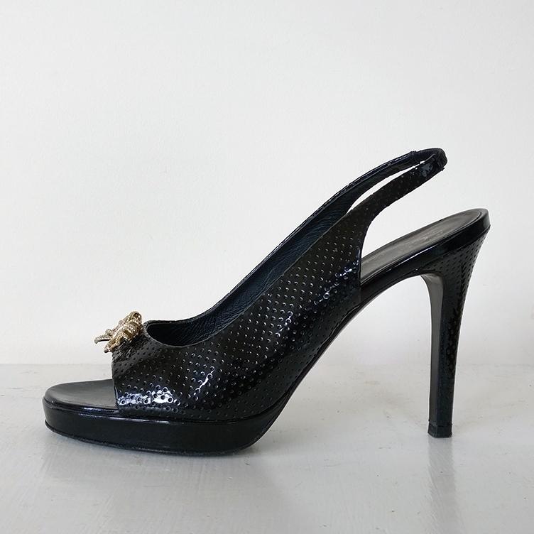 Slingback peep-toe high heel with jewel detail on toe.
