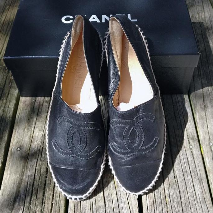 Leather top espadrilles with stitched insignia. Look new, in box.