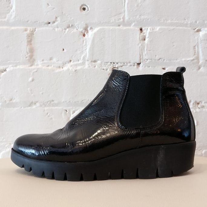 Patent leather pull-on shoe boot with lightweight rubber sole.