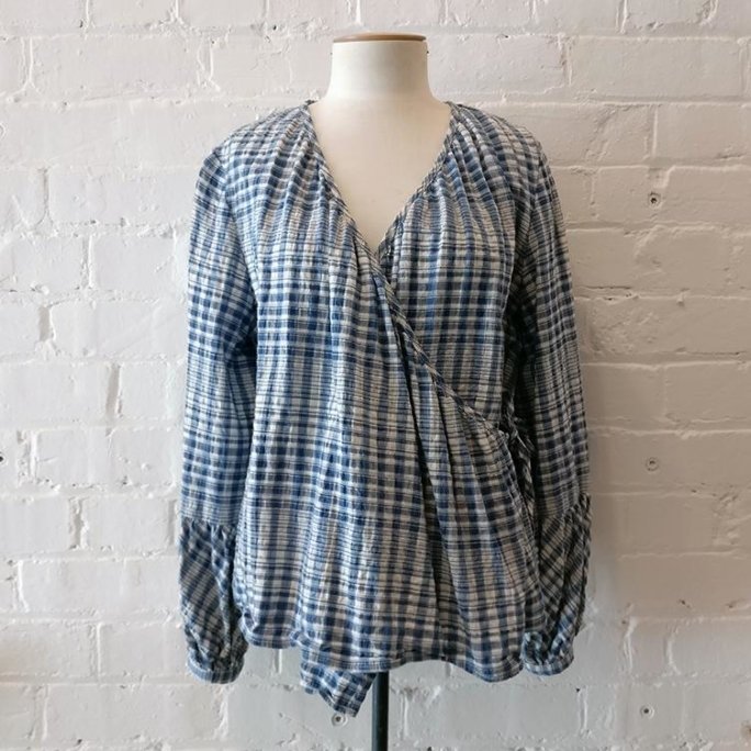 Peasant-style loose wrap blouse.