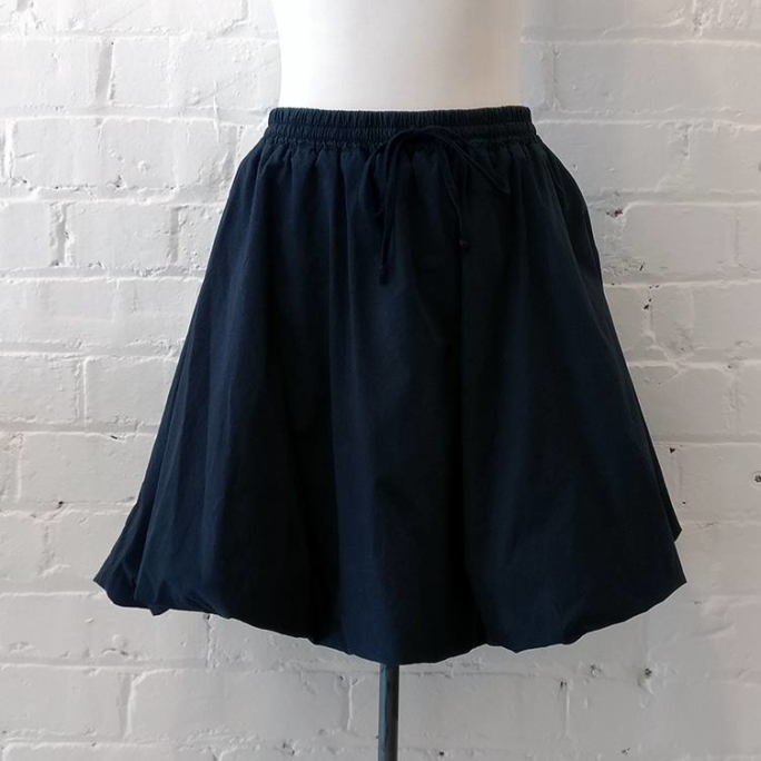 Lined cotton puffball skirt.