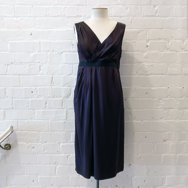 Sleeveless silk dress with exposed side zip, lined.