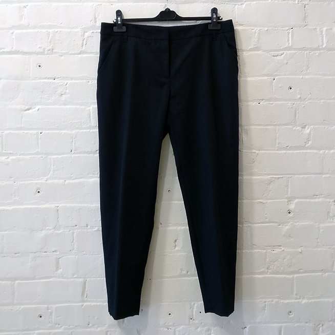 Flat front cropped trousers with ankle zip.