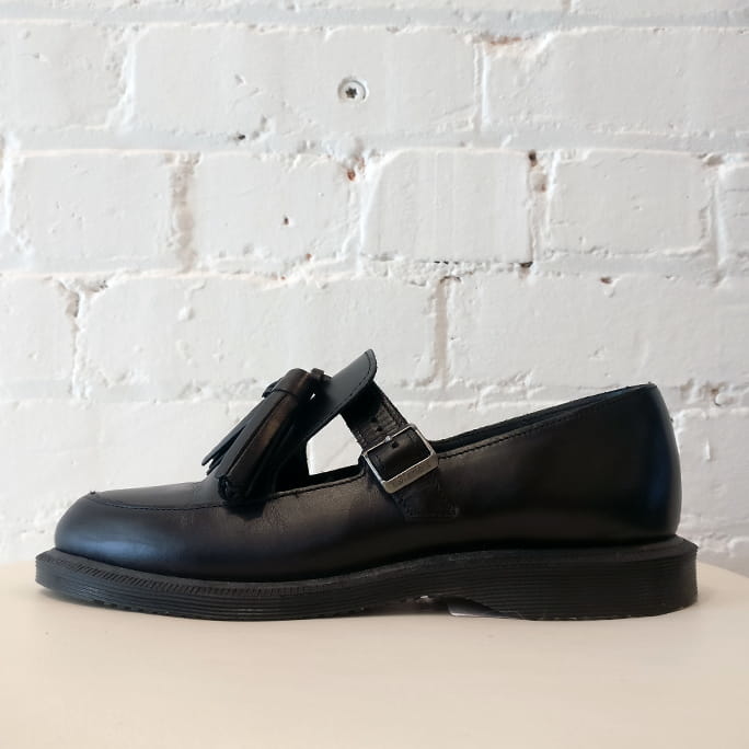 Smooth leather t-bar slip-ons with tassles.