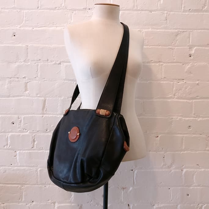 Shoulder bag with brown leather accents.