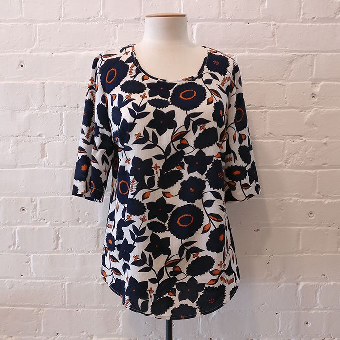 Short sleeve top with floral pattern.