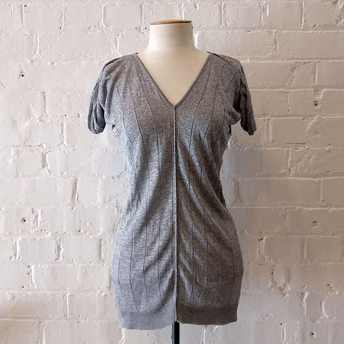 Silver v-neck knit top.