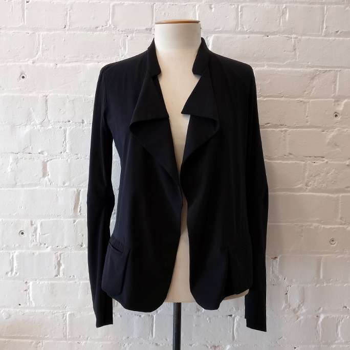 Unstructured soft jacket with front pockets.