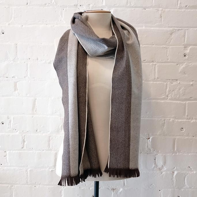 Merino long scarf with hand-cut fringing.