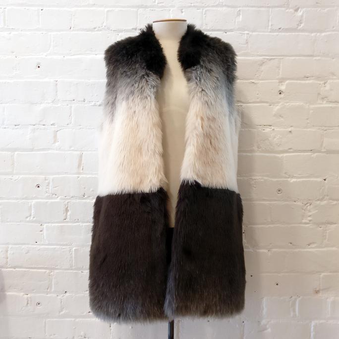 Fun faux fur long vest with pockets, fully lined.