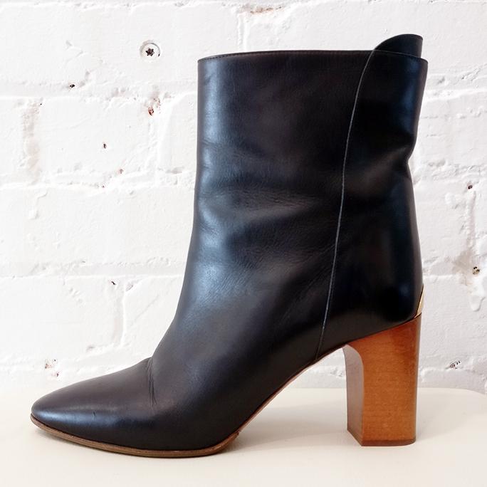 Short leather boot with wooden heel.