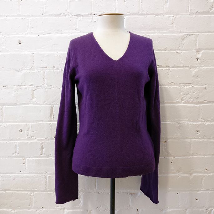 Wool mix v-neck knit with flared sleeve.
