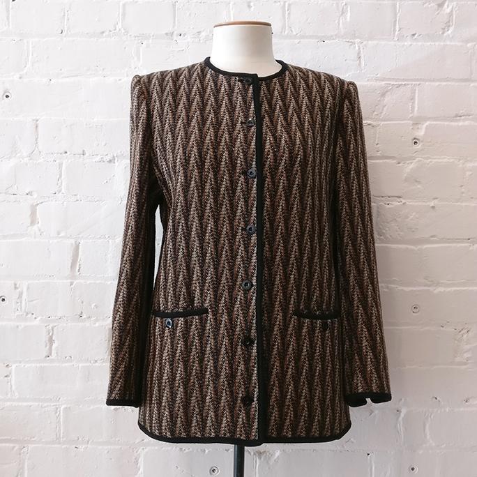 Collarless jacket with patch pockets, fully lined.