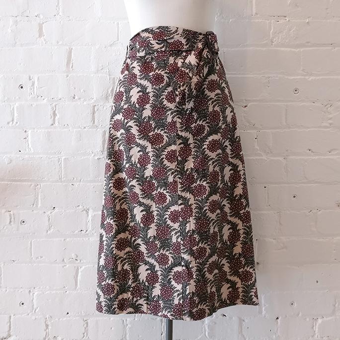 A-line floral skirt with belt and pockets, unlined.