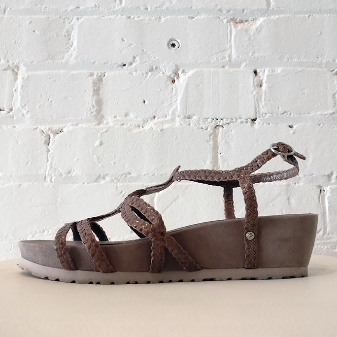 Strappy sandal with lightweight molded sole.