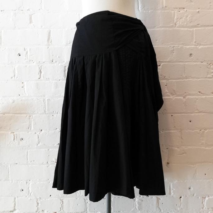 Cotton wrap skirt with pleated front.