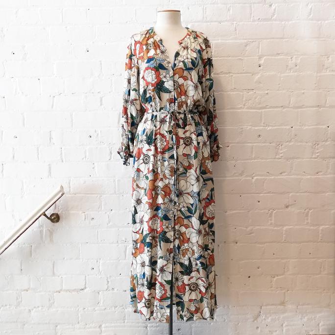 Collarless floral print shirt dress with pockets.