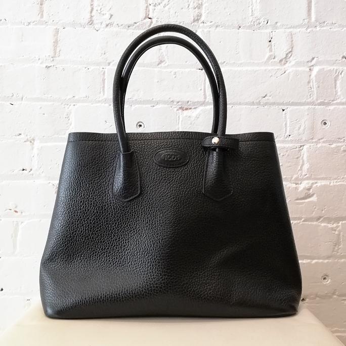 Black textured leather hand bag.