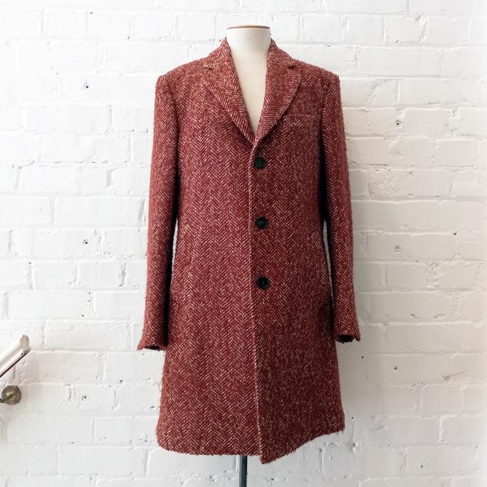 Wool mix woven short coat with pockets, unlined.