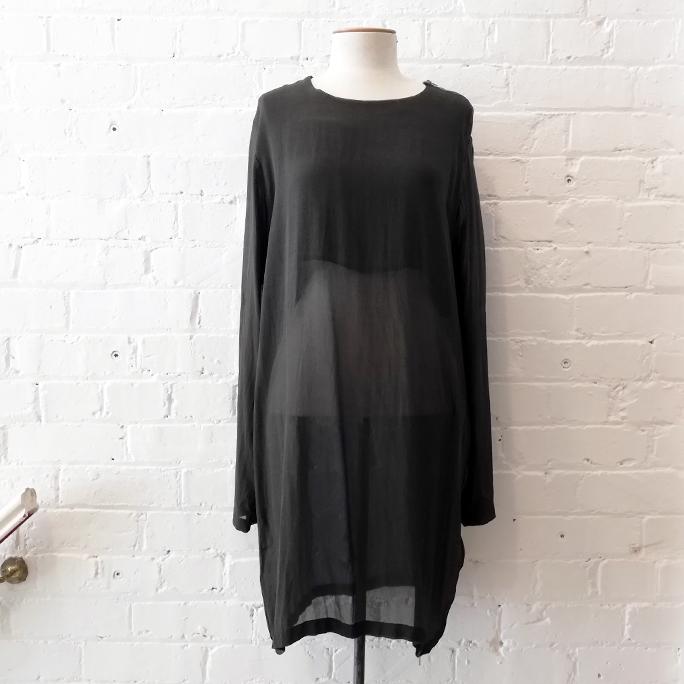 "Sheer Cover" dress with shoulder and side zip.