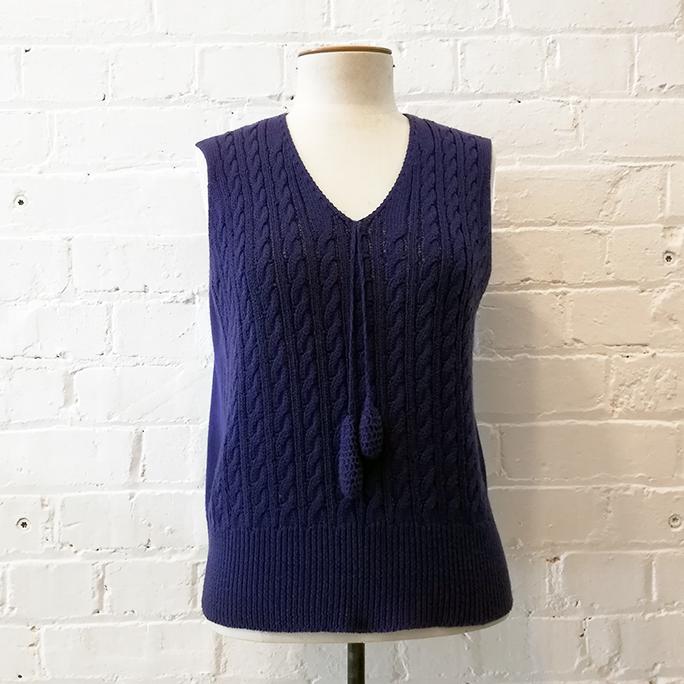 Cable knit vest.