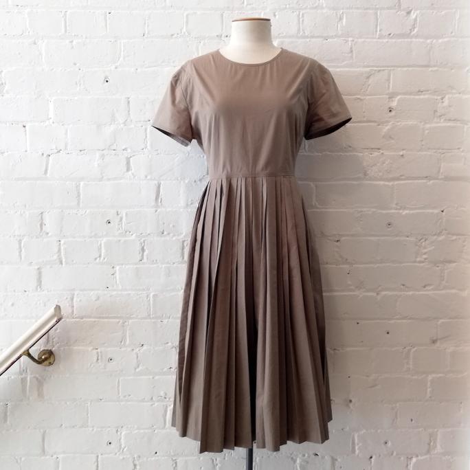 Short sleeve dress with pleat skirt.