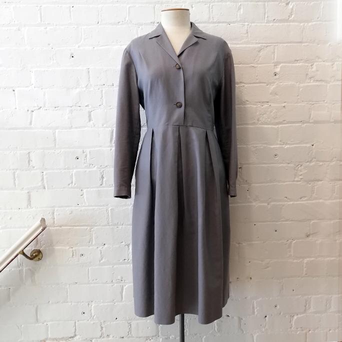 Coat style dress with pockets.