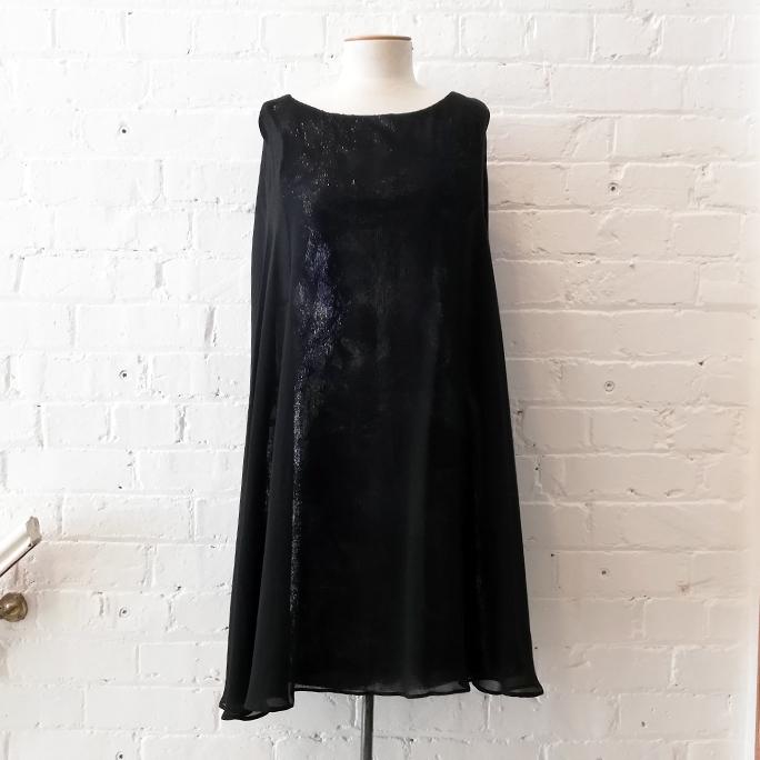 Sequin shift dress with cape-style top.