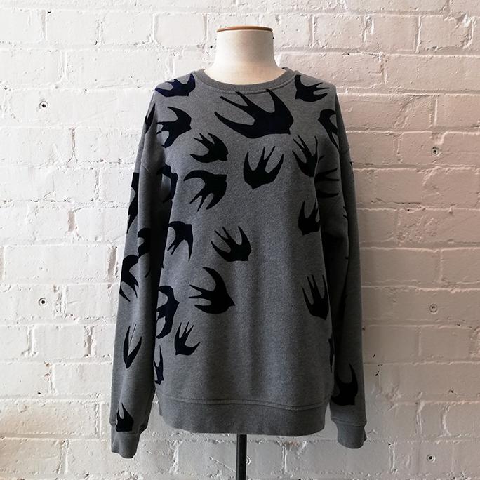 Crew top with flocked swallow design.