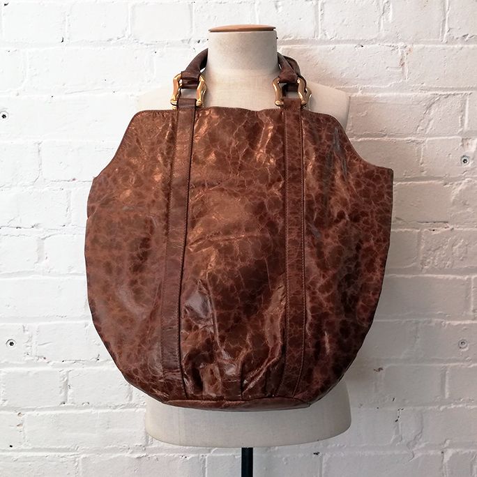 Mottled leather tote with heavy hardware.