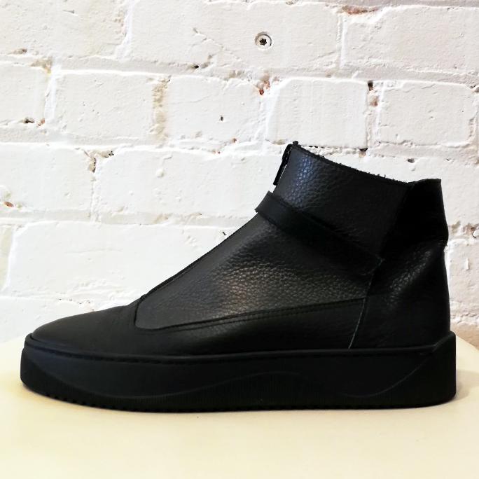 Textured leather bootie with front zip.