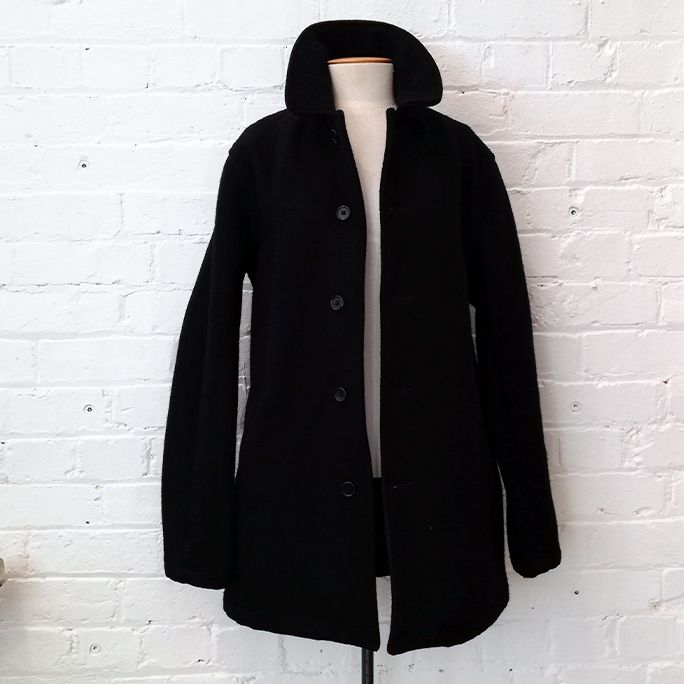 Heavy wool short coat with pockets, fully lined.