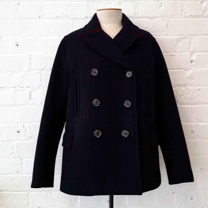 Double-breasted pea coat with quilted inner.