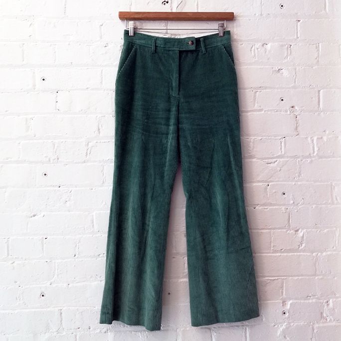 Flat-front wide leg corduroy trouser with pockets.