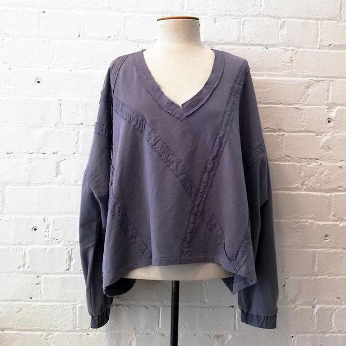 Oversize deconstructed v-neck boxy top.