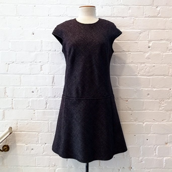 Cap sleeve drop-waist tunic dress with pockets, fully lined.