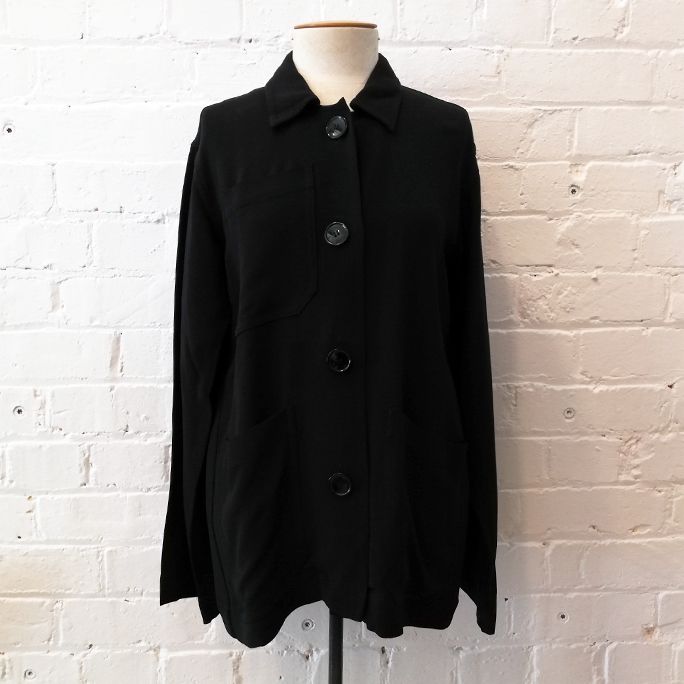 Oversize unlined jacket with patch pockets.