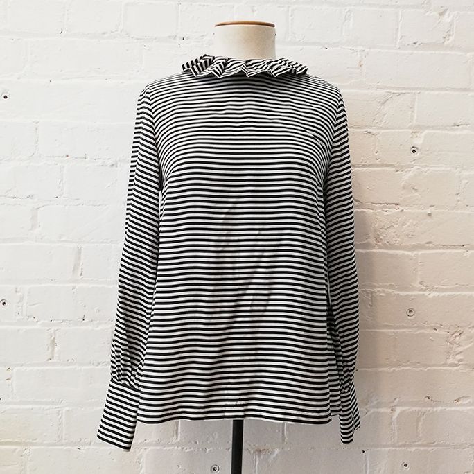 Silk stripe top with ruffle collar and zip back.