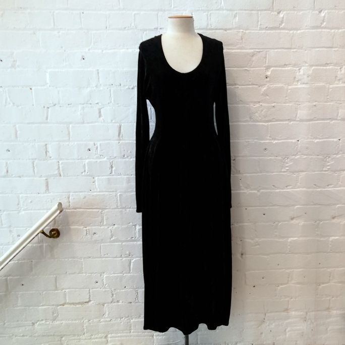 Vintage stretch velvet dress with tulip skirt and deep scoop neck.