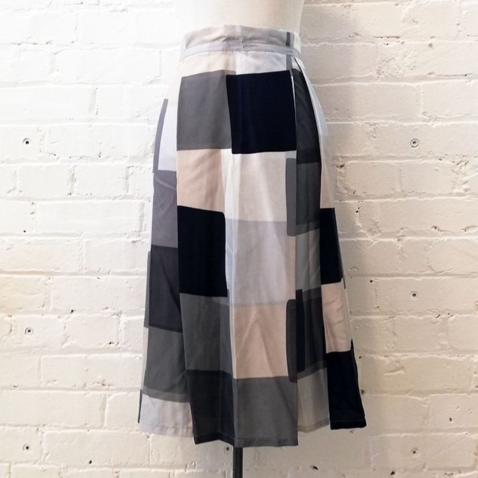 Box pleat silk skirt with geometric print.