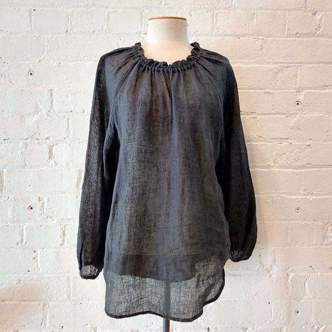 Loose fit linen top with raglan sleeve.