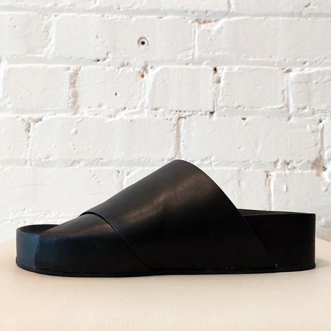 Leather slides with rubber sole.