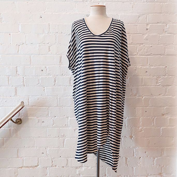 Oversize stripe dress with asymmetric hem.