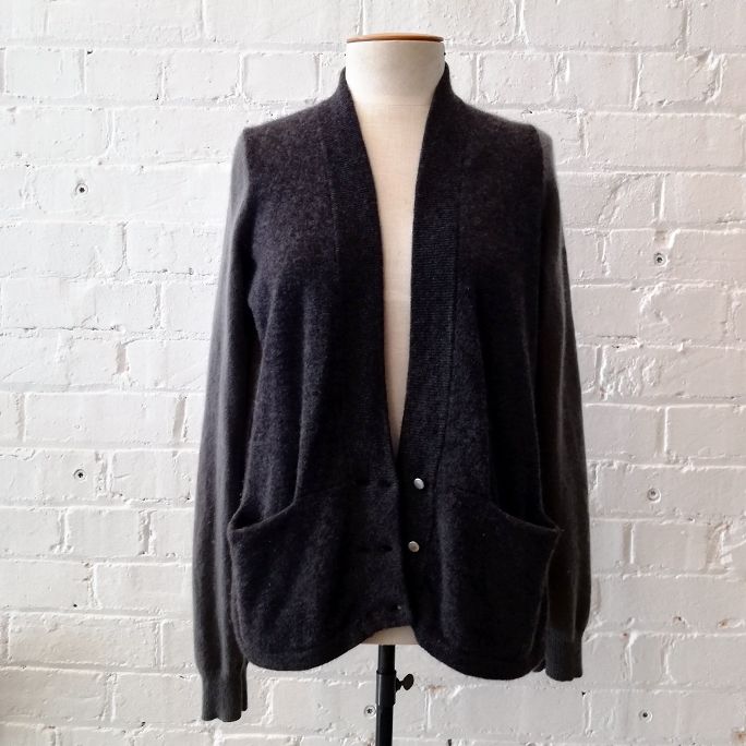 Cashmere cardigan with pockets and contrast panels.