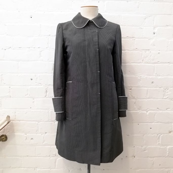 Silk pinstripe coat with Peter Pan collar and pockets.