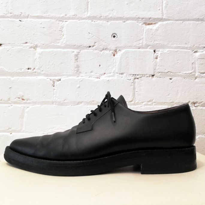 Pointy-toe leather lace-up.